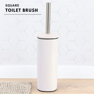 a white toilet brush on bathroom floor