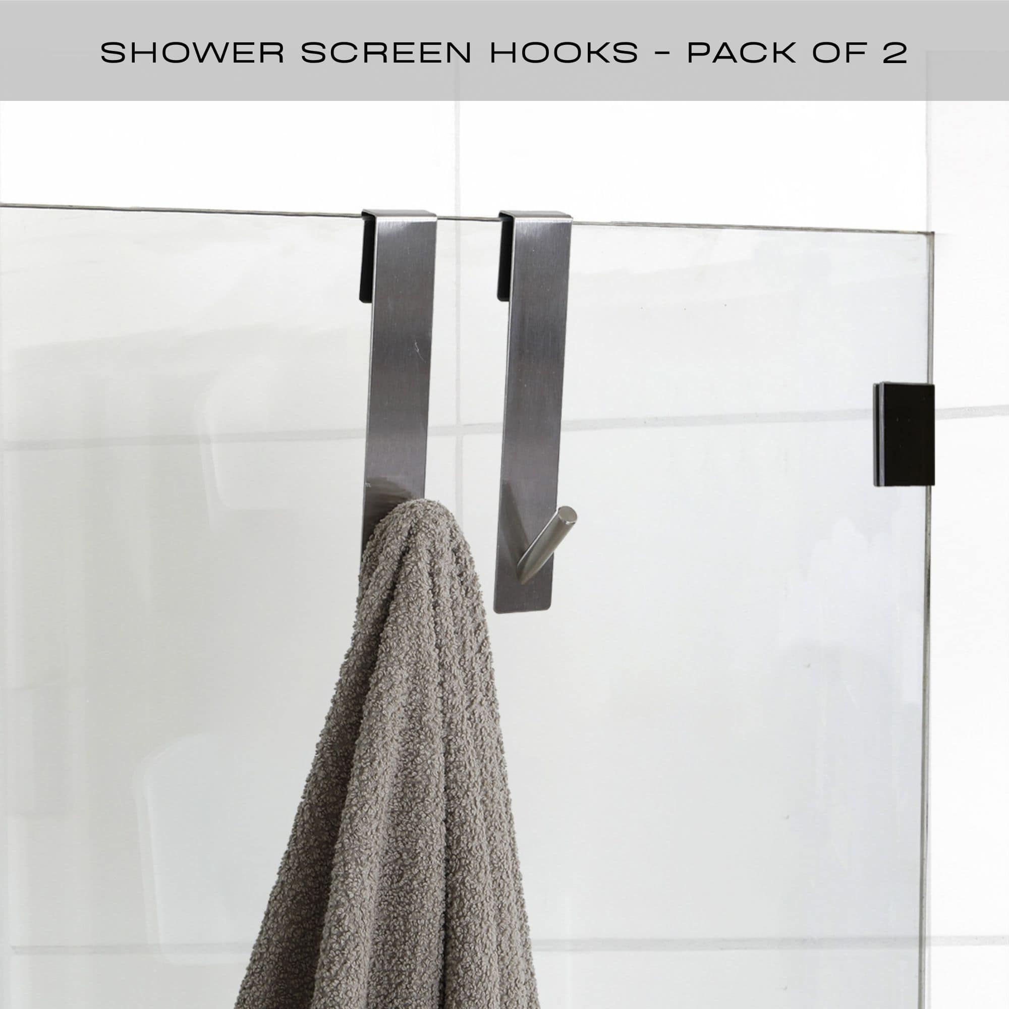 chrome shower door hooks on frameless door with towel hanging