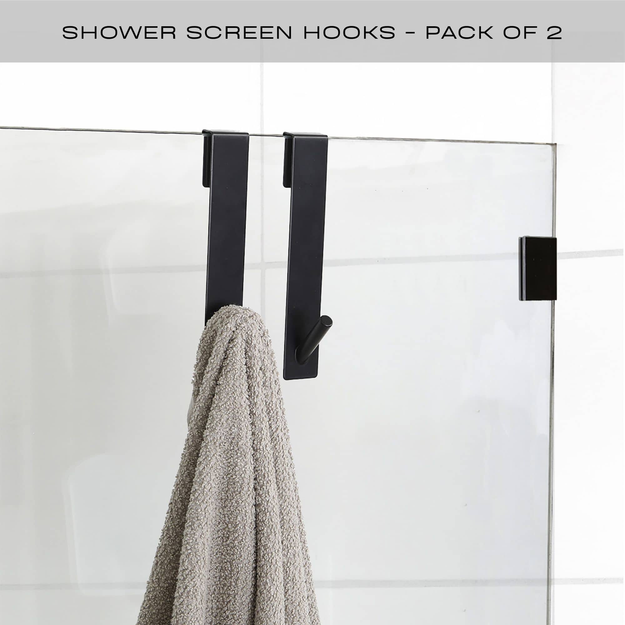 black shower door hooks on frameless door with towel hanging