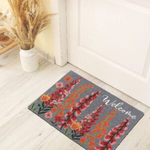 printed coco mat on the floor in front of inside door