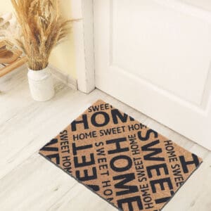 printed coco mat on the floor in front of inside door