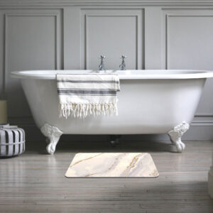 Classic white clawfoot bathtub with a stylish marble diatomite bath mat placed on a wooden floor
