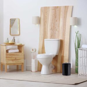 a black trash can in stylish and modern bathroom