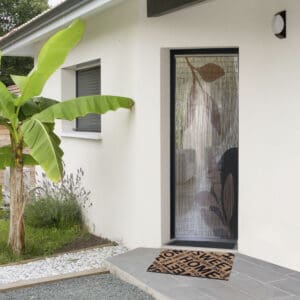 picture of outside entrance door with doormat on the floor