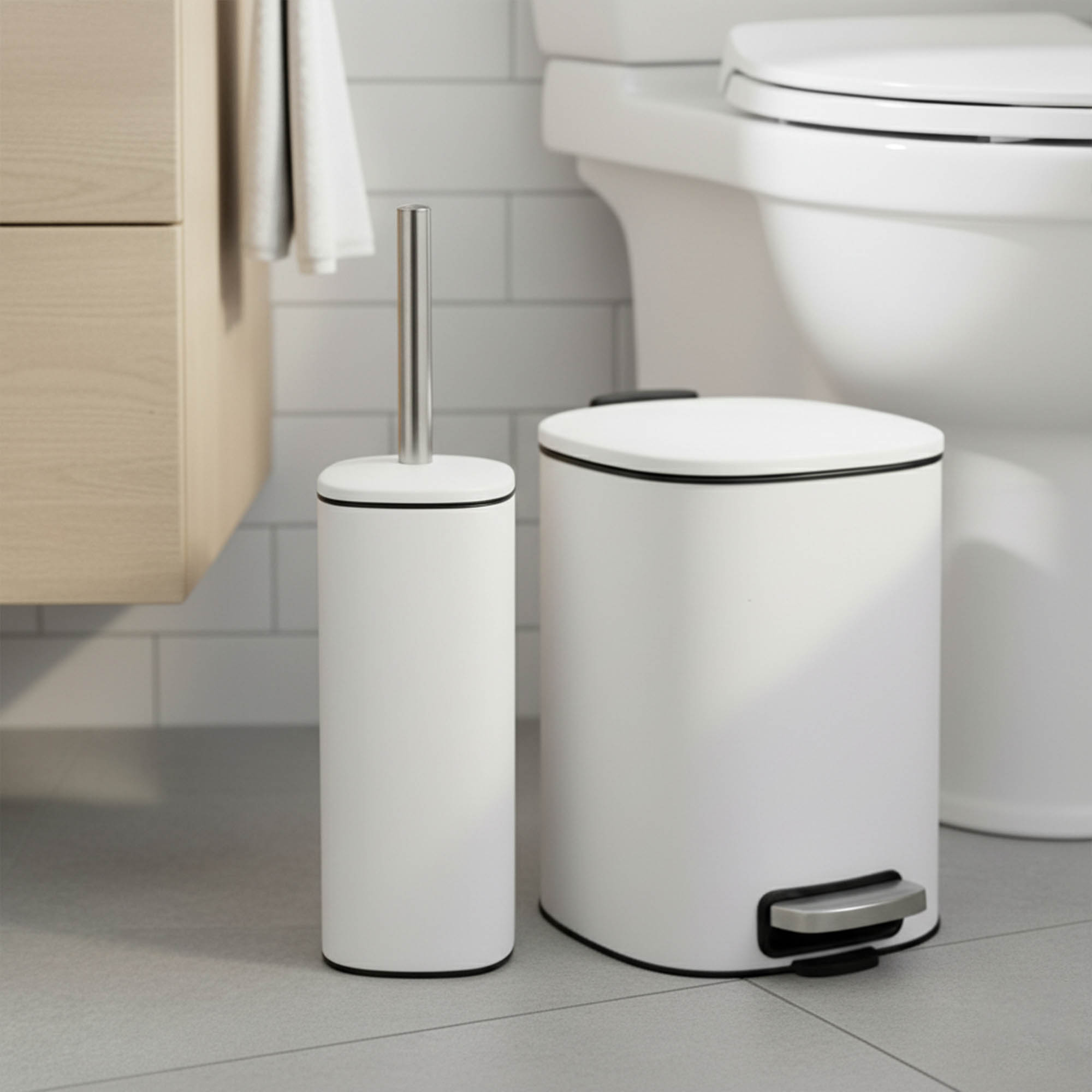 White pedal trash can paired with toilet brush next to toilet