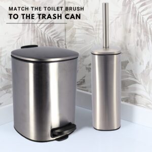 Matching brushed stainless steel square toilet brush and step trash can set with black trim against tropical leaf wallpaper