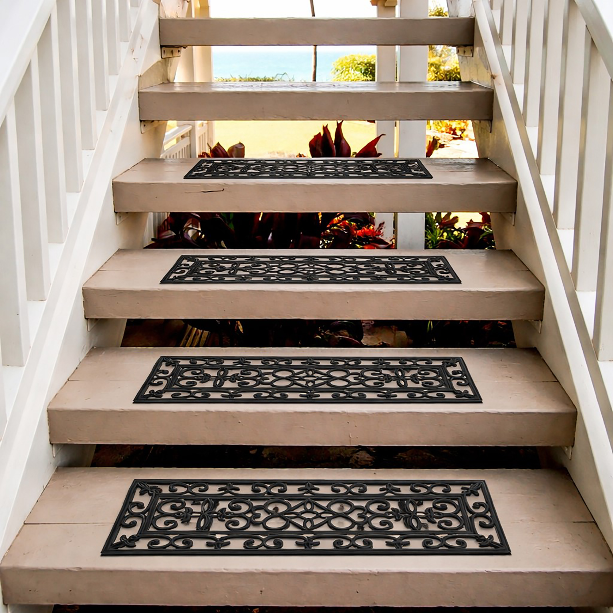 Decorative rubber stair mats on outdoor wooden stairs