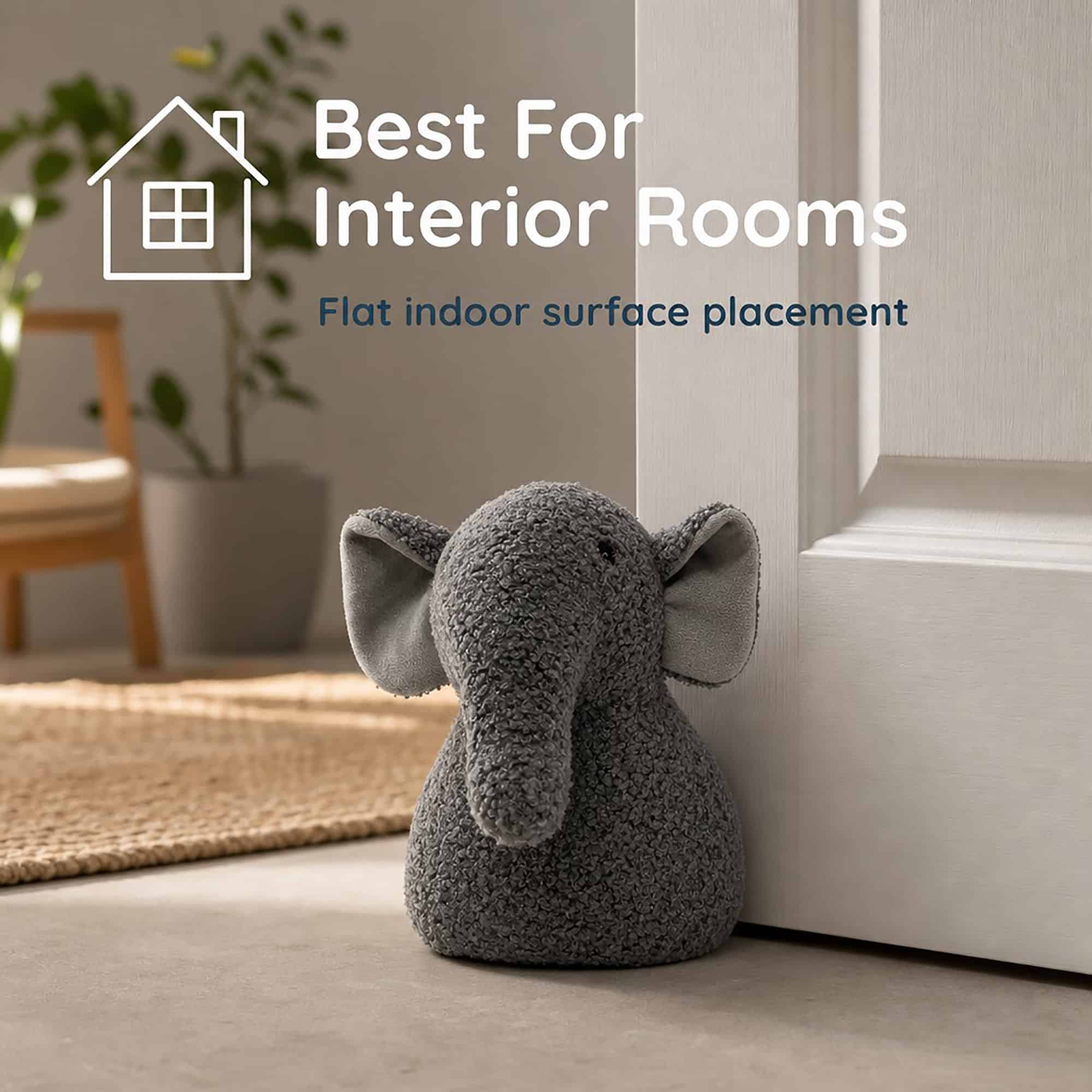 Grey elephant door stopper propping open a white door, chair and plant in the background, with a house icon. On-image text: "Best For Interior Rooms," "Flat indoor surface placement."
