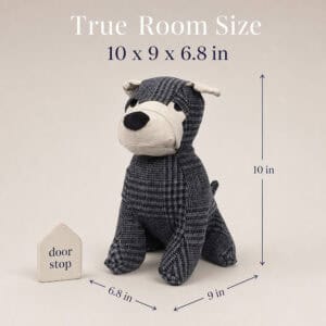 Charcoal plaid dog door stopper on a cream background beside a small door-stop block for scale, with measurement callouts. On-image text: "True Room Size," "10 x 9 x 6.8 in," "10 in," "9 in," "6.8 in."