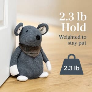 Grey mouse door stopper propping open a white door on hardwood floor, with a weight icon. On-image text: "2.3 lb Hold," "Weighted to stay put," "2.3 lb."