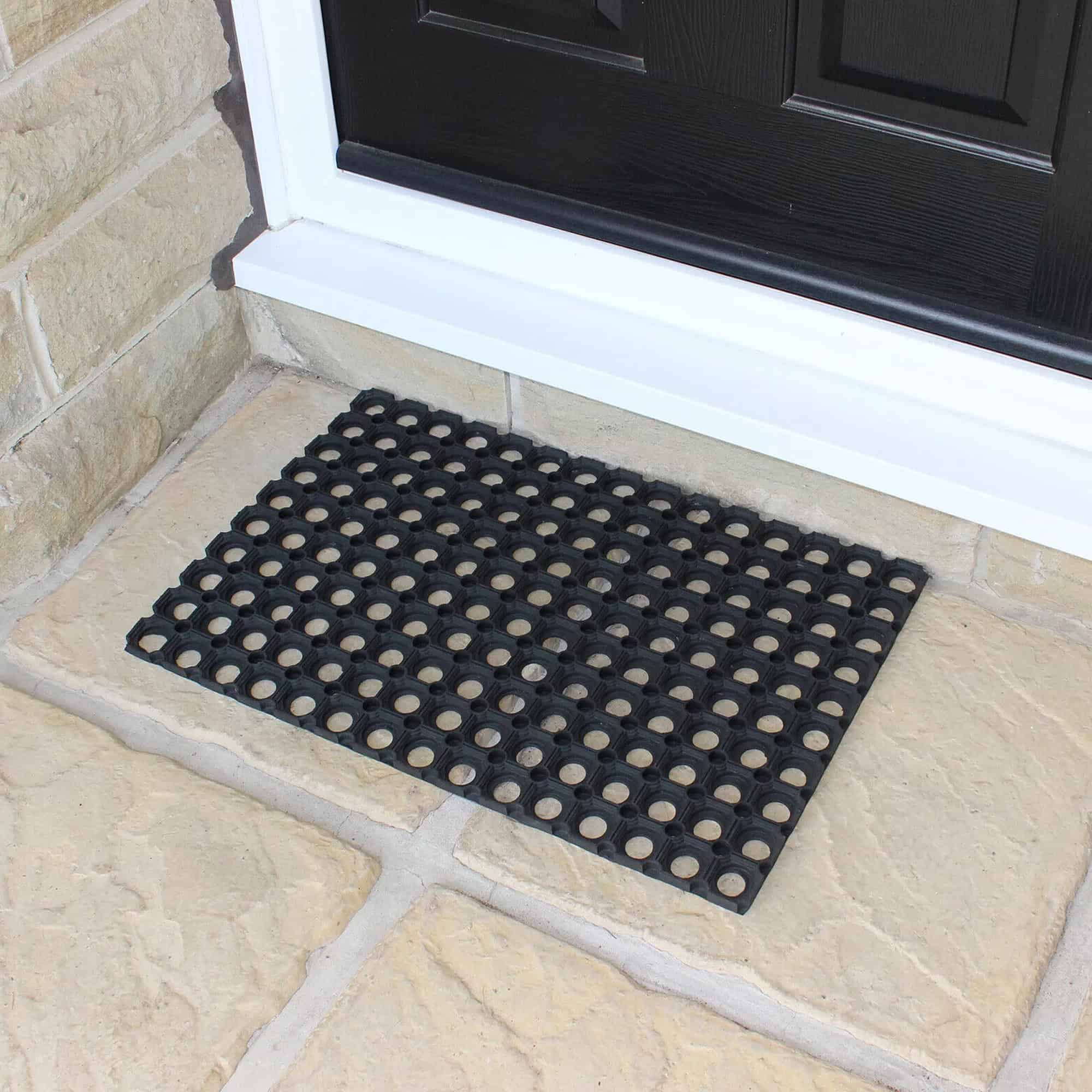 small rubber mat in situation on the floor at front door