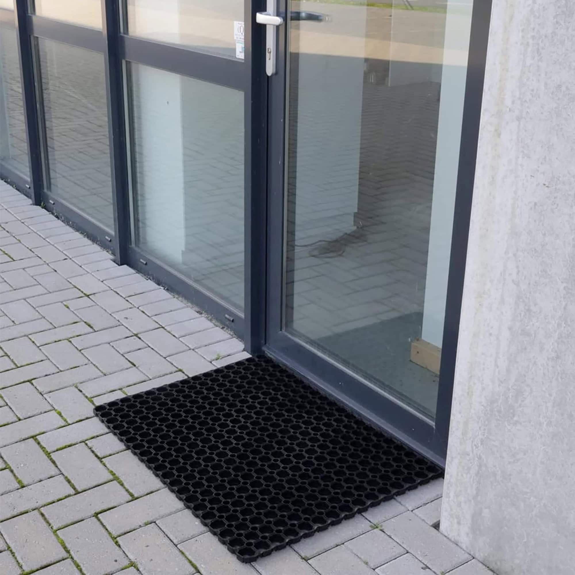 medium rubber mat in situation on the floor at front door