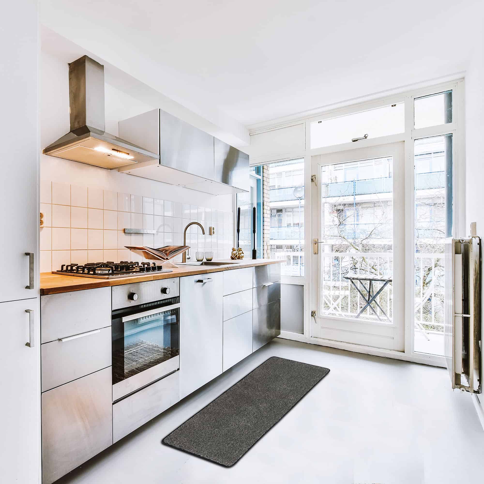 modern kitchen with black runner mat on the floor