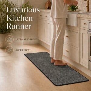 Charcoal grey kitchen runner along a counter with bare feet resting on it, highlighting ultra absorbent and super soft comfort underfoot.