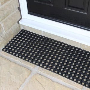 small rubber mats connected in situation on the floor at front door