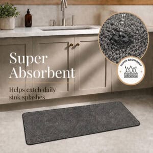 Charcoal grey kitchen rug set with water absorbing into the looped pile, showing how the set soaks up everyday sink splashes.