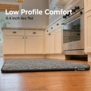 Side view of a thin low profile charcoal grey kitchen mat lying flat on the floor, measuring 0.4 inch for an easy, trip-free fit.