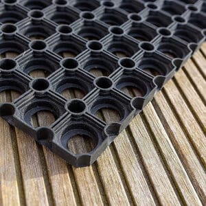 detail of the rubber mat on wooden floor
