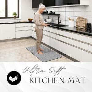 8- Woman standing comfortably on an ultra-soft anti-fatigue kitchen mat in a bright modern kitchen.