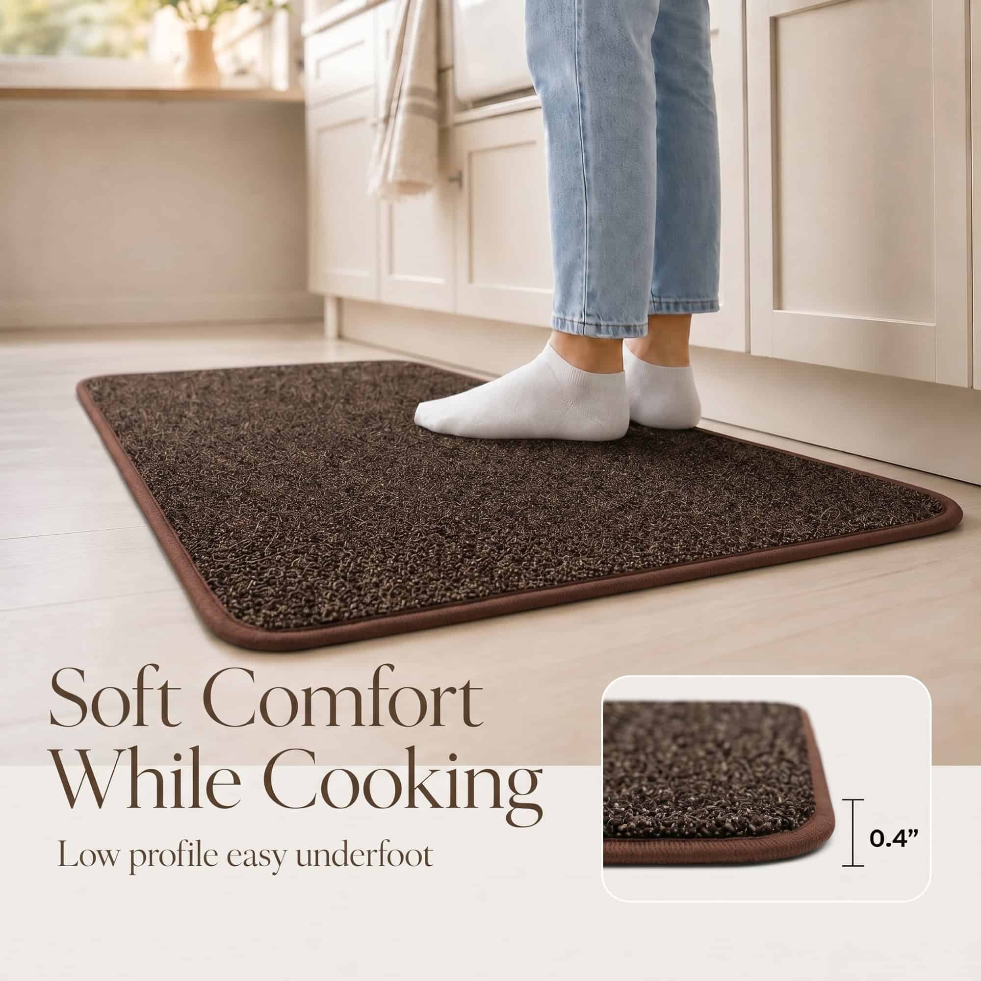 Person in socks on a low profile chocolate brown kitchen mat, showing the 0.4 inch soft comfort of the set while cooking.