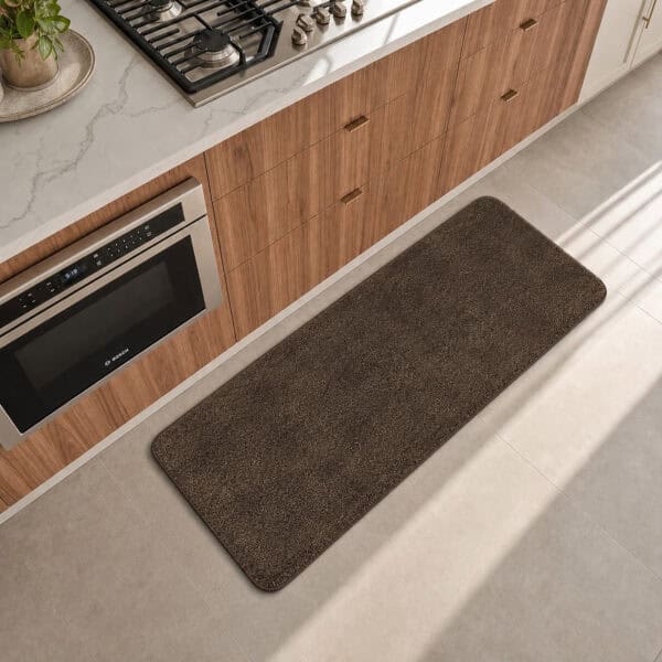Chocolate brown kitchen runner laid along the counter in a modern kitchen, adding warm decorative contrast to the floor.