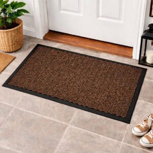 Tan indoor door mat placed in front of white entry door on tile floor