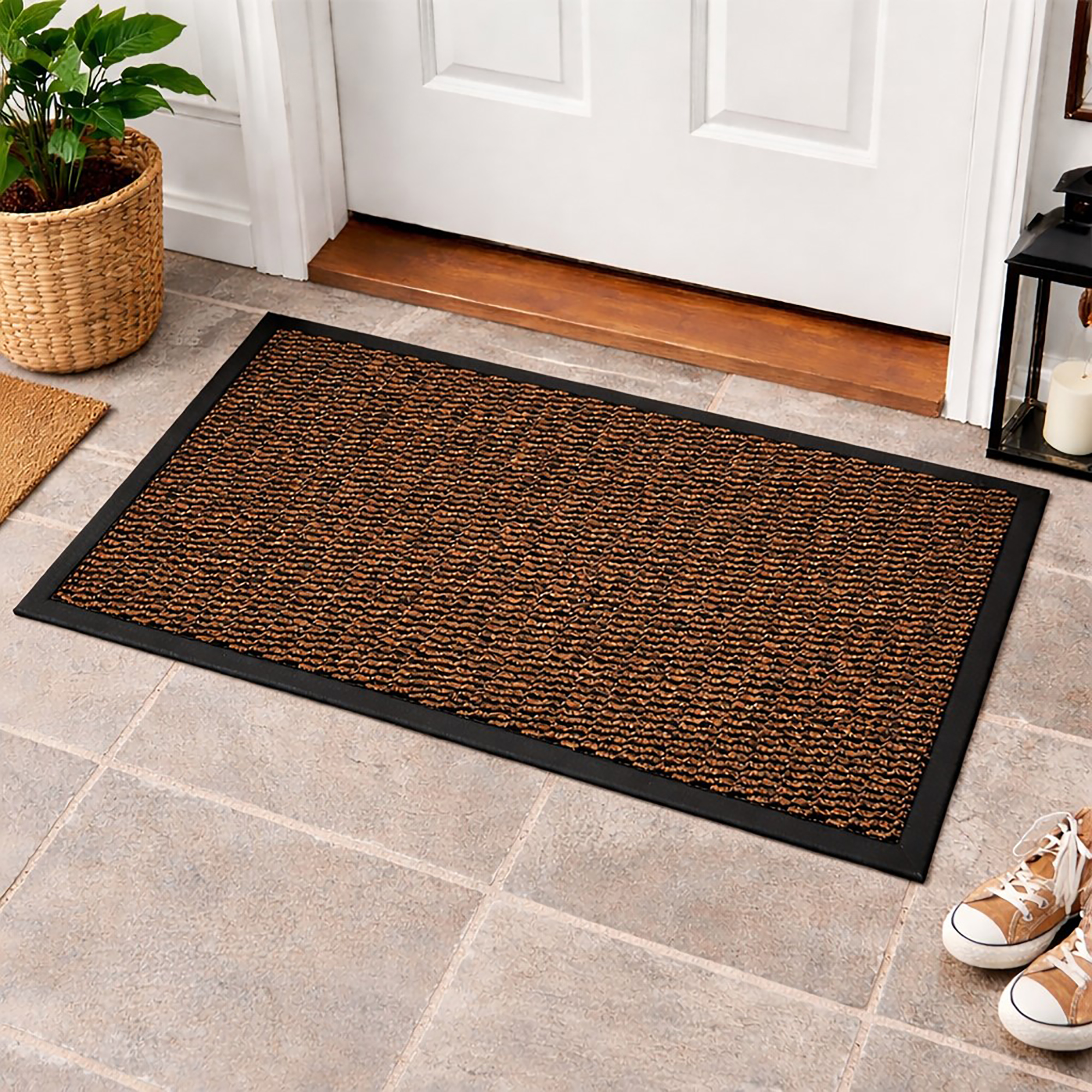 Tan indoor door mat placed in front of white entry door on tile floor