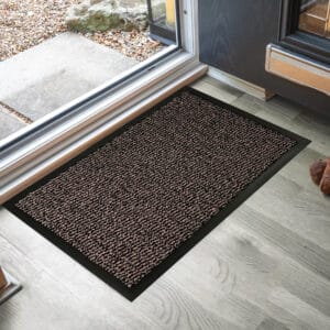 Tan low profile doormat showing easy to clean surface and rubber backing