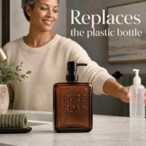 Woman replacing a plastic hand soap bottle with the amber glass Pure Soap dispenser on a bathroom vanity
