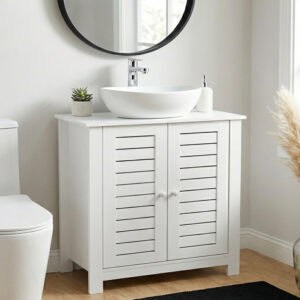“White bathroom sink cabinet with vented doors in modern setting”