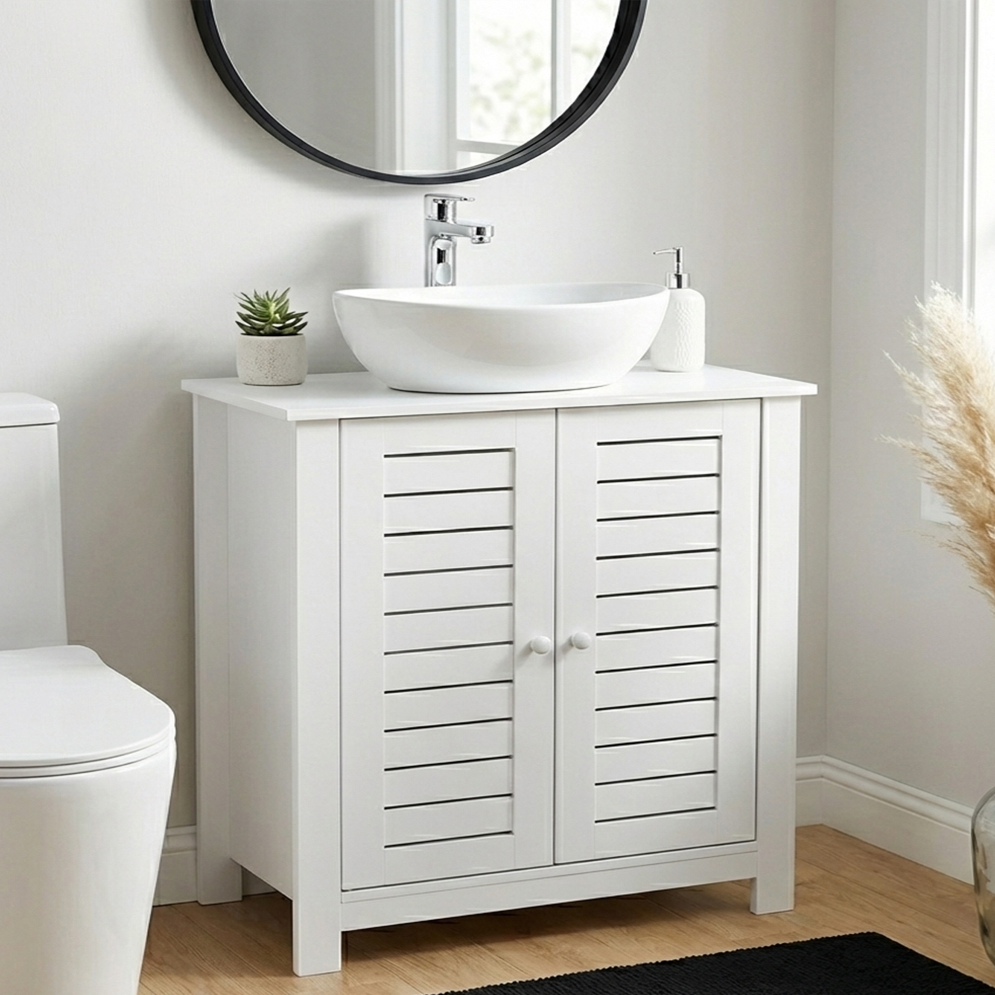 “White bathroom sink cabinet with vented doors in modern setting”