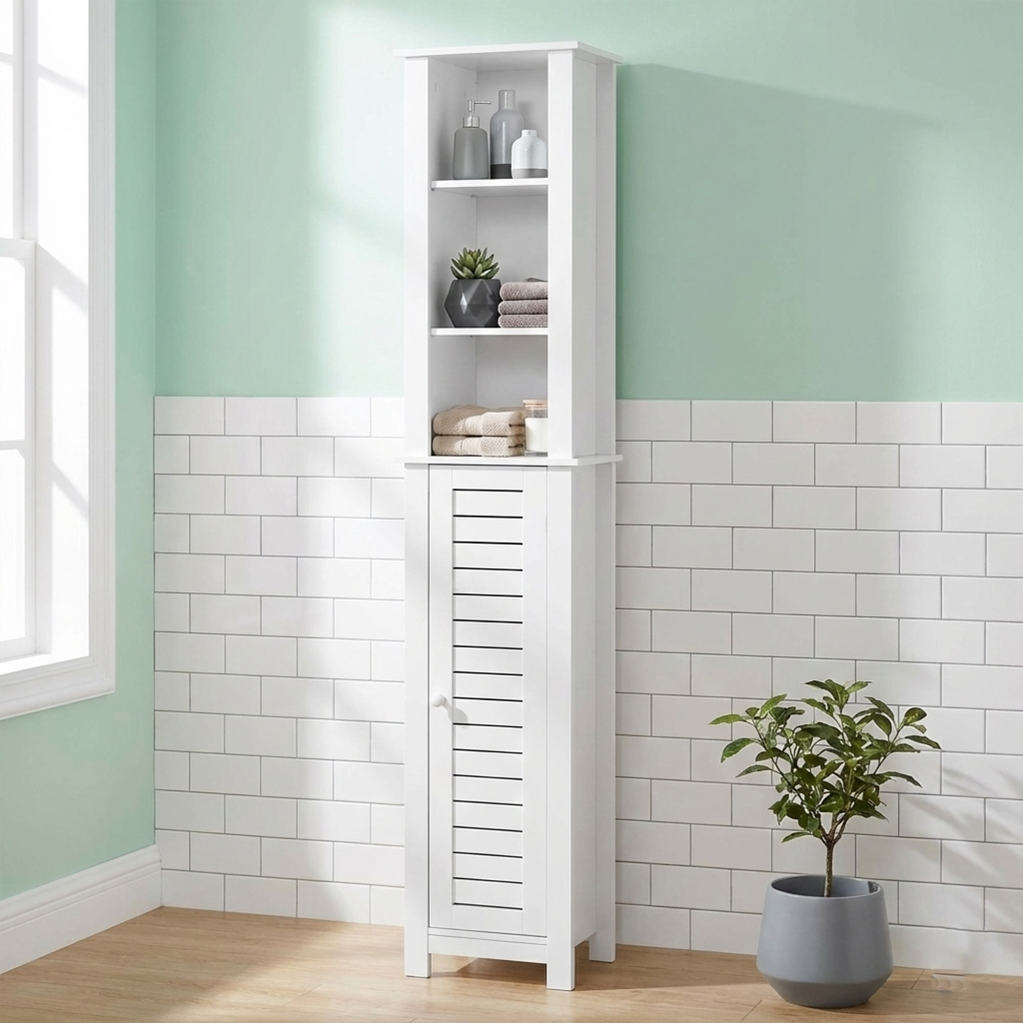 “Tall white bathroom cabinet with open shelves and vented door, styled with towels and toiletries.”