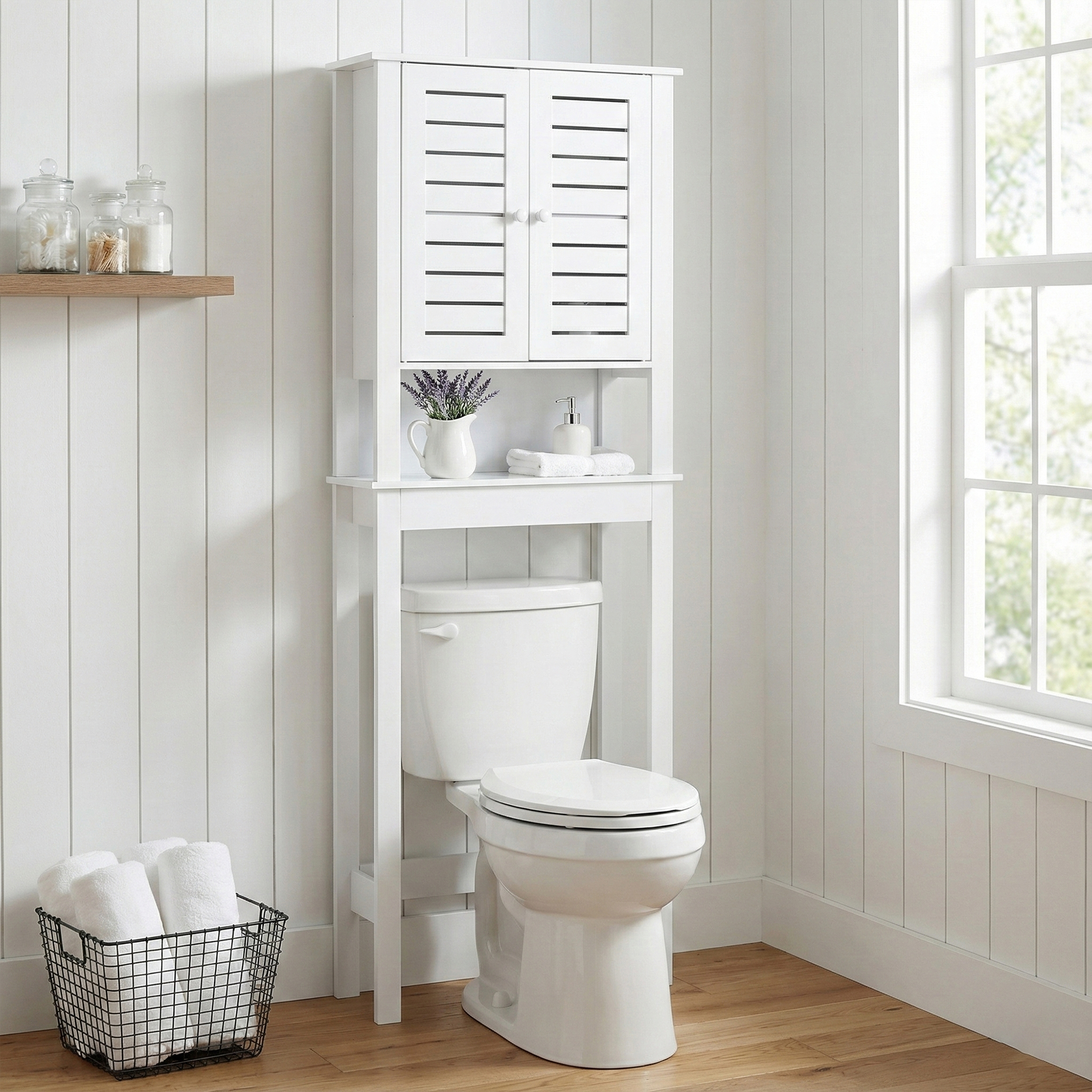 Over-Toilet Storage Cabinet - A white over-the-toilet storage cabinet featuring slatted double doors, providing extra storage space in a compact design.