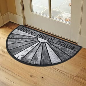 Monochrome Welcome Mat Styled Near Entryway: A stylish half-circle doormat with the text "Home Sweet Home" placed inside a modern home entryway.