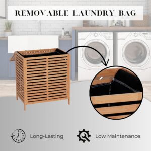 Bamboo laundry hamper open with callout showing removable black fabric two-compartment liner bag, with washing machines in background