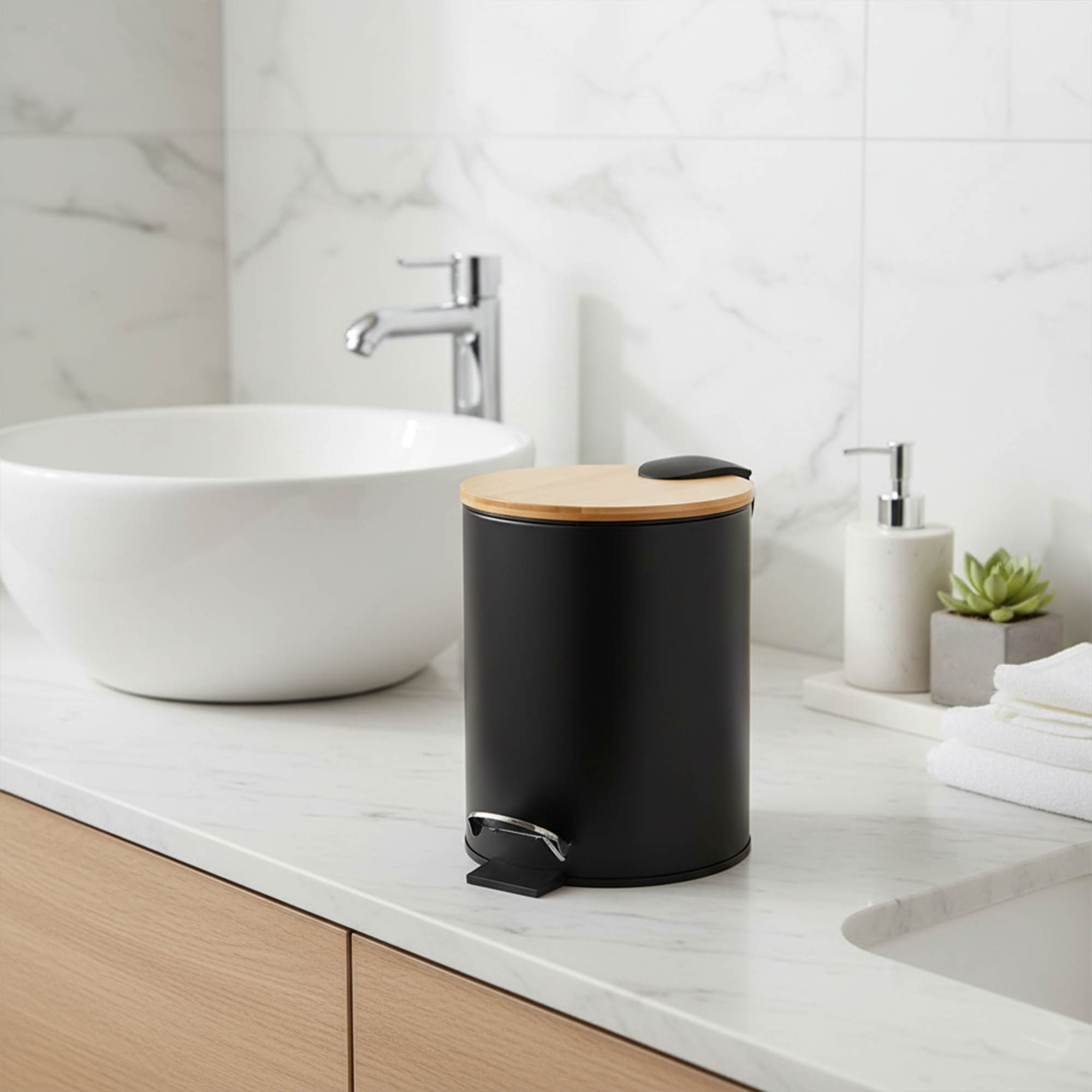 Black step trash can with bamboo lid on bathroom vanity countertop
