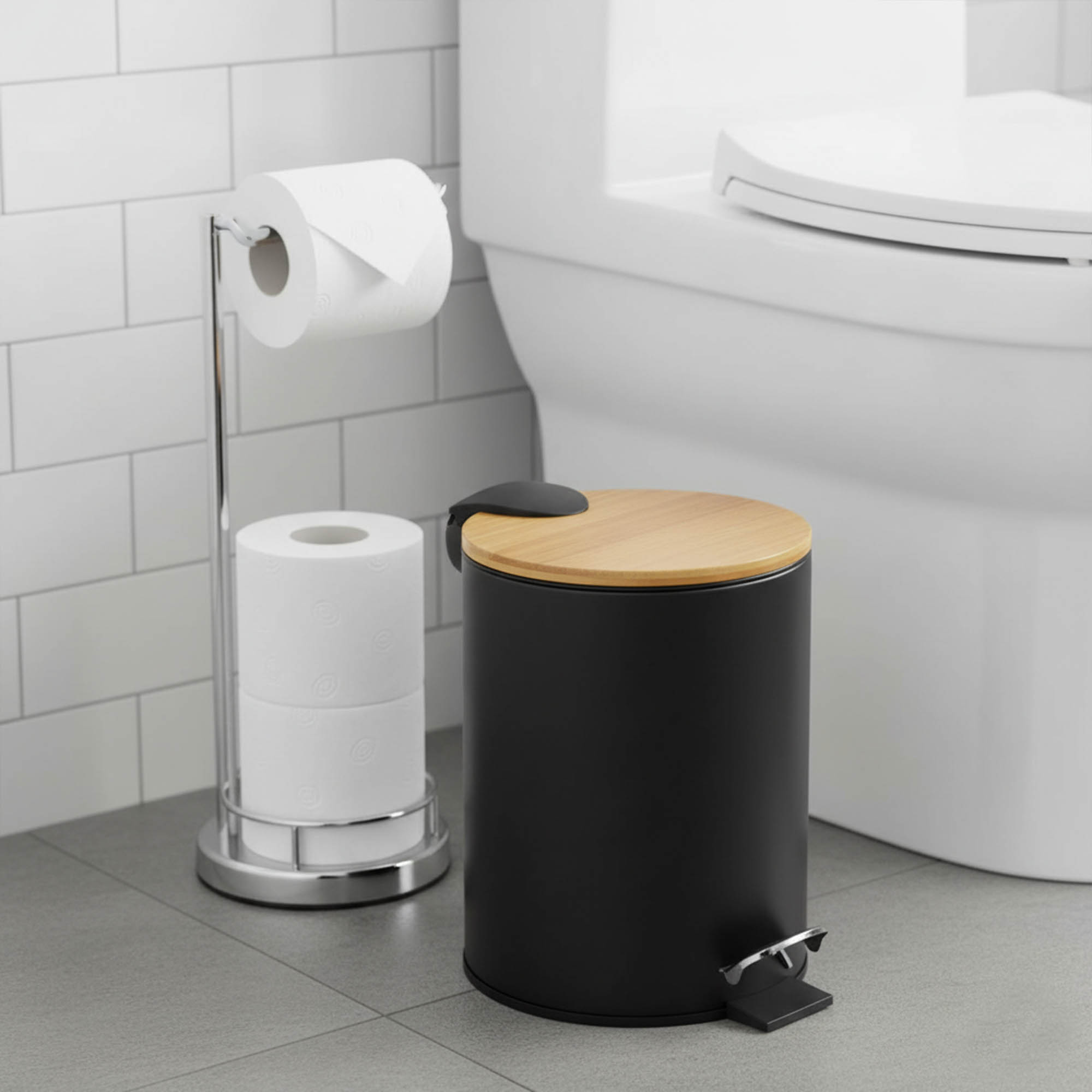 Black step trash can with bamboo lid placed next to toilet on bathroom floor