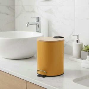Yellow step trash can with bamboo lid on bathroom countertop