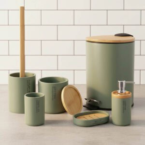 Green 6-piece bathroom accessory set with bamboo lids and accents displayed on a modern countertop