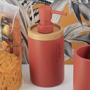 Red dispenser styled with a bold tropical background