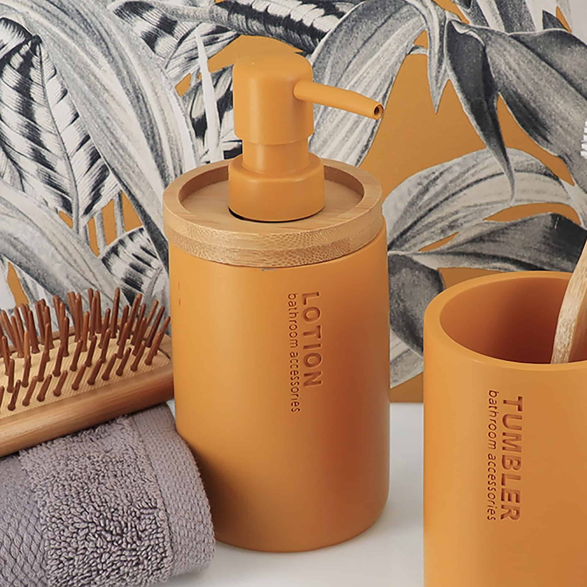 Mustard yellow dispenser styled with a bold tropical background