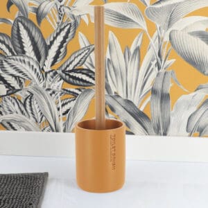 Mustard yellow toilet brush holder paired with a bamboo handle, displayed in a clean and modern design setting.
