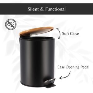 Open black trash can showing the soft-close bamboo lid and the easy-to-use black foot pedal for convenient trash disposal.