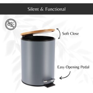 Open gray trash can showing the soft-close bamboo lid and the easy-to-use black foot pedal for convenient trash disposal.