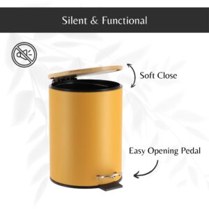 Open yellow trash can showing the soft-close bamboo lid and the easy-to-use black foot pedal for convenient trash disposal.