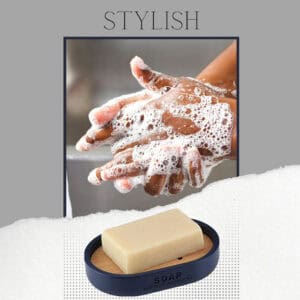 Close-up of hands being lathered with soap, emphasizing the stylish navy blue soap dish with bamboo insert used for convenience and elegance.