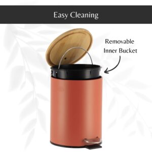 Terracotta step trash can with its bamboo lid open, revealing a removable inner bucket with a handle for hassle-free cleaning and maintenance.