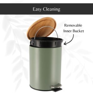 Green step trash can with its bamboo lid open, revealing a removable inner bucket with a handle for hassle-free cleaning and maintenance.