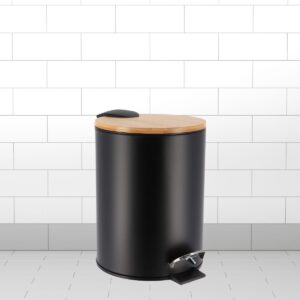 Black trash bin with bamboo lid and pedal, styled with white tiled walls.