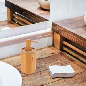 Mustard Yellow dispenser blending into a rustic wooden bathroom decor